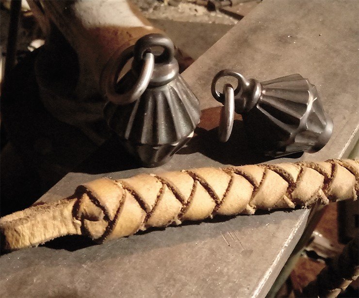Battle-flail, a weapon in the form of a short stick, has a metal beater, suspended from the end of the strap. Reconstructed from a find in the Altai krai (Srostki culture). Photo by S. Borisenko