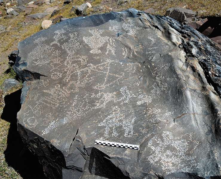 Akshow petroglyphs. This stone bears an imprint of an entire set of five precious vessels in different sizes, one of which contains a flower intended to enhance its beneficial effect. Near the vessels there are images of right and left swastikas, stupas, solar symbols, and ibexes in all possible embodiments. Zanskar, 2019 Akshow petroglyphs. This stone bears an imprint of an entire set of five precious vessels in different sizes, one of which contains a flower intended to enhance its beneficial effect. Near the vessels there are images of right and left swastikas, stupas, solar symbols, and ibexes in all possible embodiments. Zanskar, 2019