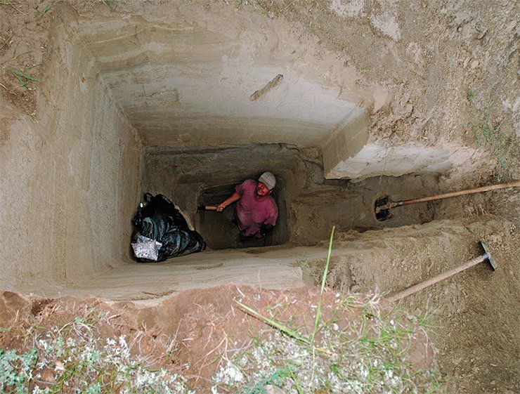 A pit dug in sediments of the dam lake. A coaly fragment sufficient for radiocarbon dating was found at a depth of 2 m A pit dug in sediments of the dam lake. A coaly fragment sufficient for radiocarbon dating was found at a depth of 2 m