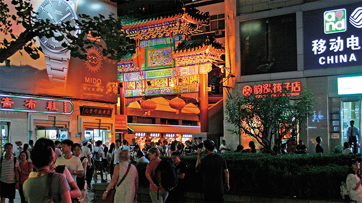 There are always plenty of people at the entrance to the night market in Wangfujing There are always plenty of people at the entrance to the night market in Wangfujing