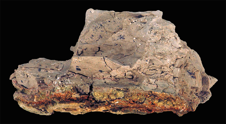 About 65 Myr ago, at the turn of the Cretaceous and Tertiary periods (C–T), an asteroid with a diameter of about 10 km crashed into the Earth where now the Yucatan Peninsula is. This event created the famous Chicxulub crater. A huge amount of debris thrown into the atmosphere settled all over the Earth, forming the so-called C–T boundary clay layer. Right: C–T boundary clay sample from the southeast of Spain with a 2–3-mm yellowish-orange oxidized iron layer at the base, enriched in chemical elements (Ir, Co, Cr, and Ni) from the bolide. © James St. John