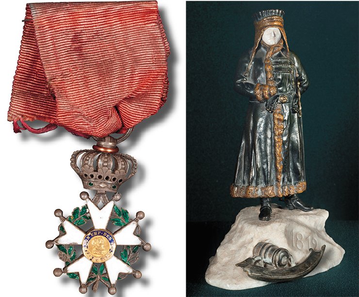 Left: the badge of the order of the Legion of Honour, the French national order instituted by Napoleon Bonaparte on 19 May 1802 by the example of the knight’s orders. Presented by D. G. Burylin at the exhibition “1812” in Moscow at the Emperor’s Russian Historical Museum. France. 1810. Silver, enamel. Length 40 mm. Right: Napoleon. Presented by D. G. Burylin at the exhibition of 1812 in Moscow at the Emperor’s Russian Historical Museum. An unknown author. Russia (?). The end of 19th — beginning of the 20th. c. Bronze, ebony, stone Left: the badge of the order of the Legion of Honour, the French national order instituted by Napoleon Bonaparte on 19 May 1802 by the example of the knight’s orders. Presented by D. G. Burylin at the exhibition “1812” in Moscow at the Emperor’s Russian Historical Museum. France. 1810. Silver, enamel. Length 40 mm. Right: Napoleon. Presented by D. G. Burylin at the exhibition of 1812 in Moscow at the Emperor’s Russian Historical Museum. An unknown author. Russia (?). The end of 19th — beginning of the 20th. c. Bronze, ebony, stone