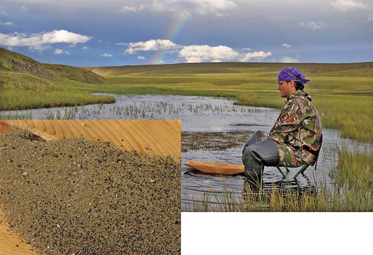 A stream sediment sample in a placer jig with kimberlite pyropes and picroilmenites. Such a jig is made of a single piece of wood. In spite of looking archaic, it works no worse than a mineral separation plant. The content of the mineral fraction in the sample increases by a factor of up to 30,000. Expedition of the Triassic team, northern Yakutia, 2010