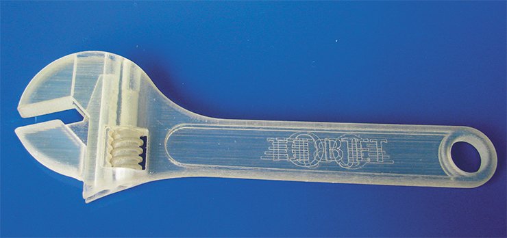 Additive manufacturing allows not only manufacturing of the components with complex shapes but also with integrated movable parts – all in one process. One of the examples – a functioning adjustable wrench manufactured on the 3-D printer OBJET – is shown below. OBJET is a true jet printer using polymerizing chemicals instead of inks. This machine with the resolution of 600×600×1600 dpi (42×42×16 µm) can manufacture components using hard and soft (rubber-like) transparent or colored polymers. The smallest thickness of the layer in this machine is a few times smaller than the thickness of a human hair, which allows manufacturing the components with very small elements Additive manufacturing allows not only manufacturing of the components with complex shapes but also with integrated movable parts – all in one process. One of the examples – a functioning adjustable wrench manufactured on the 3-D printer OBJET – is shown below. OBJET is a true jet printer using polymerizing chemicals instead of inks. This machine with the resolution of 600×600×1600 dpi (42×42×16 µm) can manufacture components using hard and soft (rubber-like) transparent or colored polymers. The smallest thickness of the layer in this machine is a few times smaller than the thickness of a human hair, which allows manufacturing the components with very small elements