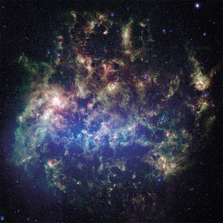 Этa животрепещущая фотография, полученная телескопом Спитцера (NASA), показывает Большое Магелланово облако – спутник нашей галактики Млечный Путь. Большое Магелланово облако находится на расстоянии в 160 000 световых лет от Земли. Это одна из нескольких карликовых галактик, вращающихся вокруг Млечного Пути. Image credit: NASA/JPL-Caltech/STScI Этa животрепещущая фотография, полученная телескопом Спитцера (NASA), показывает Большое Магелланово облако – спутник нашей галактики Млечный Путь. Большое Магелланово облако находится на расстоянии в 160 000 световых лет от Земли. Это одна из нескольких карликовых галактик, вращающихся вокруг Млечного Пути. Image credit: NASA/JPL-Caltech/STScI