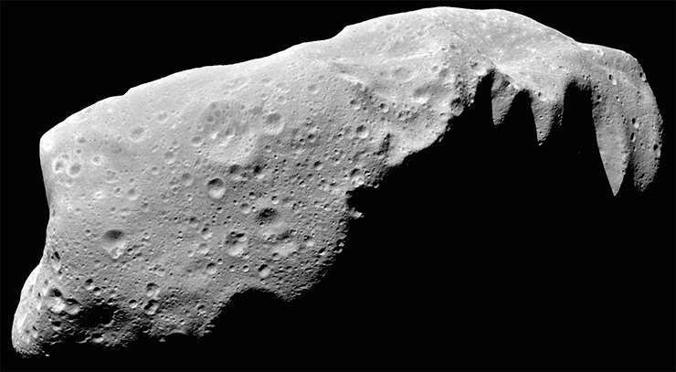 Similar to all other asteroids, this asteroid, 243 Ida, 58 km in length, maintains on its surface the traces of all the processes that took place in the solar system, first and foremost, impact events. Image from NASA’s Galileo spacecraft, 1993. Credit: NASA/JPL-Caltech Similar to all other asteroids, this asteroid, 243 Ida, 58 km in length, maintains on its surface the traces of all the processes that took place in the solar system, first and foremost, impact events. Image from NASA’s Galileo spacecraft, 1993. Credit: NASA/JPL-Caltech