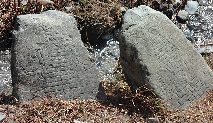 Stones with stupa images in a field near the village of Karsh Stones with stupa images in a field near the village of Karsh