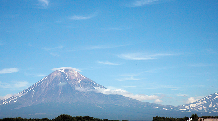 The volcano in the cloud cap near the airport of Petropavlovsk-Kamchatsky is the last souvenir of Kamchatka that we will take with us