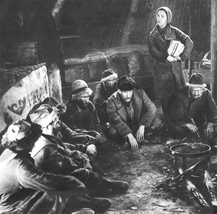 Ye. Kuzmina playing the role of a teacher (on the right) and S. Gerasimov (center) as the Selsoviet Chairman
